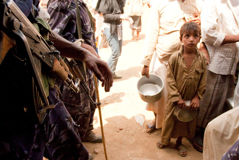Al-Mazraq, Yemen Oct. 9, 2009. A boy waits in line for food at t